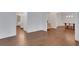 An open-concept living area with hardwood floors offers ample space and seamless flow to other rooms at 11280 Brookhollow Trl, Alpharetta, GA 30022