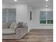Spacious living room area offers wood flooring and great natural lighting at 11280 Brookhollow Trl, Alpharetta, GA 30022