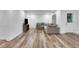 Open living room area features wood flooring and an exterior door at 11280 Brookhollow Trl, Alpharetta, GA 30022