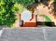 Aerial view of the property, showcasing the deck, patio, and surrounding greenery at 1875 Skidmore Cir, Lawrenceville, GA 30044