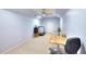 Finished basement area with ceiling fan, storage cabinet, and exercise equipment at 1875 Skidmore Cir, Lawrenceville, GA 30044