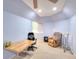 Finished basement with a desk, chair, and comfortable seating area at 1875 Skidmore Cir, Lawrenceville, GA 30044