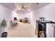 Finished basement with carpet, office area, sitting area, and gym equipment at 1875 Skidmore Cir, Lawrenceville, GA 30044