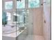 Bright bathroom featuring a glass enclosed shower and separate soaking tub at 1875 Skidmore Cir, Lawrenceville, GA 30044
