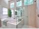 Bright bathroom featuring a glass enclosed shower and separate soaking tub at 1875 Skidmore Cir, Lawrenceville, GA 30044
