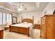Warm and inviting bedroom with tray ceiling, ceiling fan, and plenty of space at 1875 Skidmore Cir, Lawrenceville, GA 30044