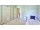Small bedroom with a twin bed, carpet, and closet at 1875 Skidmore Cir, Lawrenceville, GA 30044