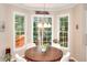 Cozy breakfast nook features large windows and a charming chandelier at 1875 Skidmore Cir, Lawrenceville, GA 30044