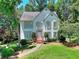 Traditional home featuring a landscaped front yard and white trim at 1875 Skidmore Cir, Lawrenceville, GA 30044