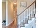 Inviting foyer with hardwood floors and stairs at 1875 Skidmore Cir, Lawrenceville, GA 30044