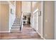 Bright foyer featuring wood floors, staircase, and high ceilings at 1875 Skidmore Cir, Lawrenceville, GA 30044