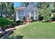 Charming two-story home with a manicured front lawn and manicured shrubs at 1875 Skidmore Cir, Lawrenceville, GA 30044