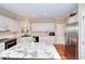 Modern kitchen with stainless steel appliances and granite countertops at 1875 Skidmore Cir, Lawrenceville, GA 30044