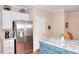 Updated kitchen features stainless appliances and an island with a granite countertop at 1875 Skidmore Cir, Lawrenceville, GA 30044