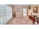Spacious living room with carpet flooring and ample natural light at 1875 Skidmore Cir, Lawrenceville, GA 30044
