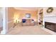 Cozy living room with a fireplace and built-in bookshelves at 1875 Skidmore Cir, Lawrenceville, GA 30044
