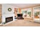 Bright living room features a fireplace, built-in shelving, and natural light at 1875 Skidmore Cir, Lawrenceville, GA 30044