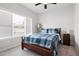 Comfortable bedroom featuring a queen-sized bed, natural light, and neutral décor at 3322 Cranston Ln, Kennesaw, GA 30144