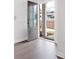 Hardwood floors lead to an open front door, framing the exterior view from the entryway at 3322 Cranston Ln, Kennesaw, GA 30144