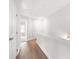 Bright hallway with wood floors and white walls, leading to other rooms at 3322 Cranston Ln, Kennesaw, GA 30144