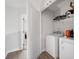 Convenient laundry room with washer, dryer, and storage shelves at 3322 Cranston Ln, Kennesaw, GA 30144