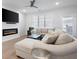 Comfortable living room with large sectional sofa, fireplace, wall-mounted television, and neutral decor at 3322 Cranston Ln, Kennesaw, GA 30144
