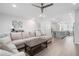 Spacious living area featuring a large sectional sofa, a view of kitchen, and modern amenities at 3322 Cranston Ln, Kennesaw, GA 30144
