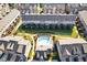 Aerial view of community, pool, putting green, and rear patios at 4104 Townsend Ln, Dunwoody, GA 30346
