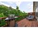 Enjoy outdoor relaxation on this private back deck with wooded views and grill at 4104 Townsend Ln, Dunwoody, GA 30346