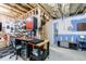 Finished basement workshop space with work bench, tool storage and ample lighting at 4104 Townsend Ln, Dunwoody, GA 30346