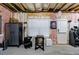 Unfinished basement space with exposed insulation, a window and door to the outside at 4104 Townsend Ln, Dunwoody, GA 30346