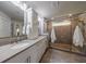 Bathroom featuring double sinks, a glass shower, and modern fixtures for a spa-like experience at 4104 Townsend Ln, Dunwoody, GA 30346