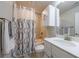 Well-lit bathroom with a shower-tub combination and a sleek white vanity at 4104 Townsend Ln, Dunwoody, GA 30346
