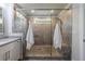 Modern bathroom features a glass-enclosed shower with gray tile and a convenient built-in bench at 4104 Townsend Ln, Dunwoody, GA 30346