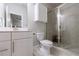 Modern bathroom with glass shower, tile, vanity, and updated fixtures at 4104 Townsend Ln, Dunwoody, GA 30346