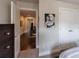 Bedroom showing the doorway and closet with a view of the hallway at 4104 Townsend Ln, Dunwoody, GA 30346