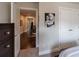 View from a bedroom of a hallway with wood floors, white trim and doors, and a staircase at 4104 Townsend Ln, Dunwoody, GA 30346
