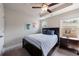 Comfortable bedroom featuring a tray ceiling, a ceiling fan and a nice view from the window at 4104 Townsend Ln, Dunwoody, GA 30346