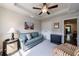 Bonus room with a tray ceiling, recessed lighting and a comfortable couch and striped chair at 4104 Townsend Ln, Dunwoody, GA 30346