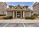 Charming community clubhouse with a peaked roofline, stone accents, and inviting entrance to the pool at 4104 Townsend Ln, Dunwoody, GA 30346