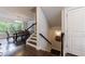 A dining area with hardwood floors, a large window, and an elegant chandelier at 4104 Townsend Ln, Dunwoody, GA 30346