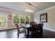 Charming dining room with natural light, wood floors, and access to the outdoor deck at 4104 Townsend Ln, Dunwoody, GA 30346