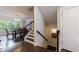 Open dining area features hardwood floors, chandelier lighting, and large windows at 4104 Townsend Ln, Dunwoody, GA 30346