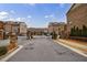 View of the gated community entrance with brick pillars and lush landscaping, offering security and curb appeal at 4104 Townsend Ln, Dunwoody, GA 30346
