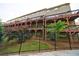 Exterior shot showcasing multiple rear-facing decks and a well-maintained lawn and garden at 4104 Townsend Ln, Dunwoody, GA 30346