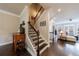 Entryway with staircase, hardwood floors, and access to the living room at 4104 Townsend Ln, Dunwoody, GA 30346