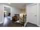 Upstairs landing with hardwood floors and views into the bedroom with tray ceiling at 4104 Townsend Ln, Dunwoody, GA 30346