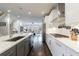 Spacious kitchen featuring modern cabinets, stainless appliances, and open layout to living area at 4104 Townsend Ln, Dunwoody, GA 30346