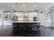 Stunning kitchen with a large island, stainless steel appliances, and modern lighting fixtures at 4104 Townsend Ln, Dunwoody, GA 30346