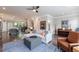 Open concept living area with hardwood floors, comfortable seating, and access to dining area at 4104 Townsend Ln, Dunwoody, GA 30346